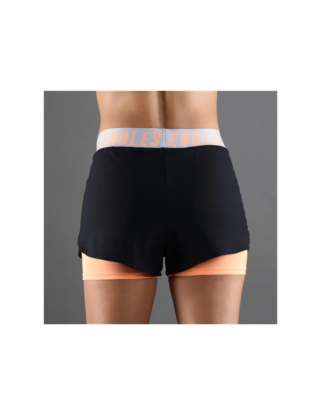 PANTALONES CORTOS DE PáDEL ENDLESS TECH ICONIC MUJER NEGROSALMóN
